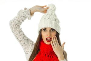 brunette girl in warm sweater and red scarf photo