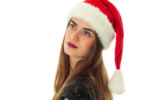 portrait of happy attractive woman in santa hat photo