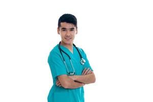 male doctor in uniform with stethoscope smiling on camera isolated on white background photo