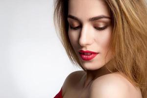 girl with red lips in studio photo