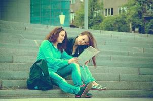 Two tourists resting on the steps photo