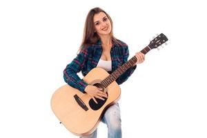 charming girl with guitar in hands photo