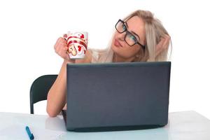 Girl with a cup and laptop photo