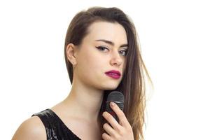 Close up of Charming girl with microphone photo