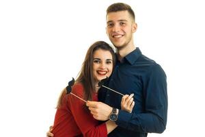 funny and wonderful guy with a girl holding paper Dummies laugh and stare into the camera close-up photo