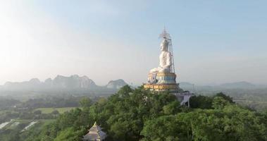 An aerial view of Big Buddha on the mountain stands prominently at Nong Hoi Temple in Ratchaburi near the Bangkok, Thailand video