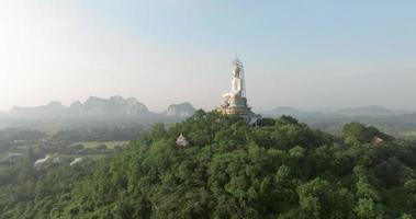 An aerial view of Big Buddha on the mountain stands prominently at Nong Hoi Temple in Ratchaburi near the Bangkok, Thailand video