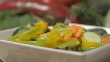 Mixed vegetables, healthy vegetarian vegan meal, Mediterranean diet food mix, raw sliced carrot zucchini pepper salad video