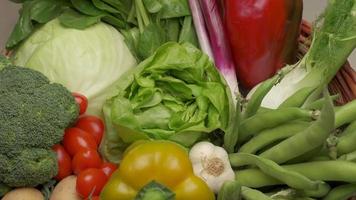 Green salad lettuce closeup rotating and various mixed vegetables. Healthy vegetarian or vegan food, Mediterranean diet nutrition video