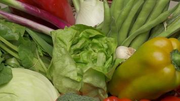 Green salad lettuce closeup rotating and various mixed vegetables. Healthy vegetarian or vegan food, Mediterranean diet nutrition video