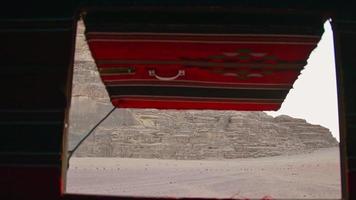 Bedouin camp tent open window view to beautiful mars alike landscape panorama of Wadi Rum desert video