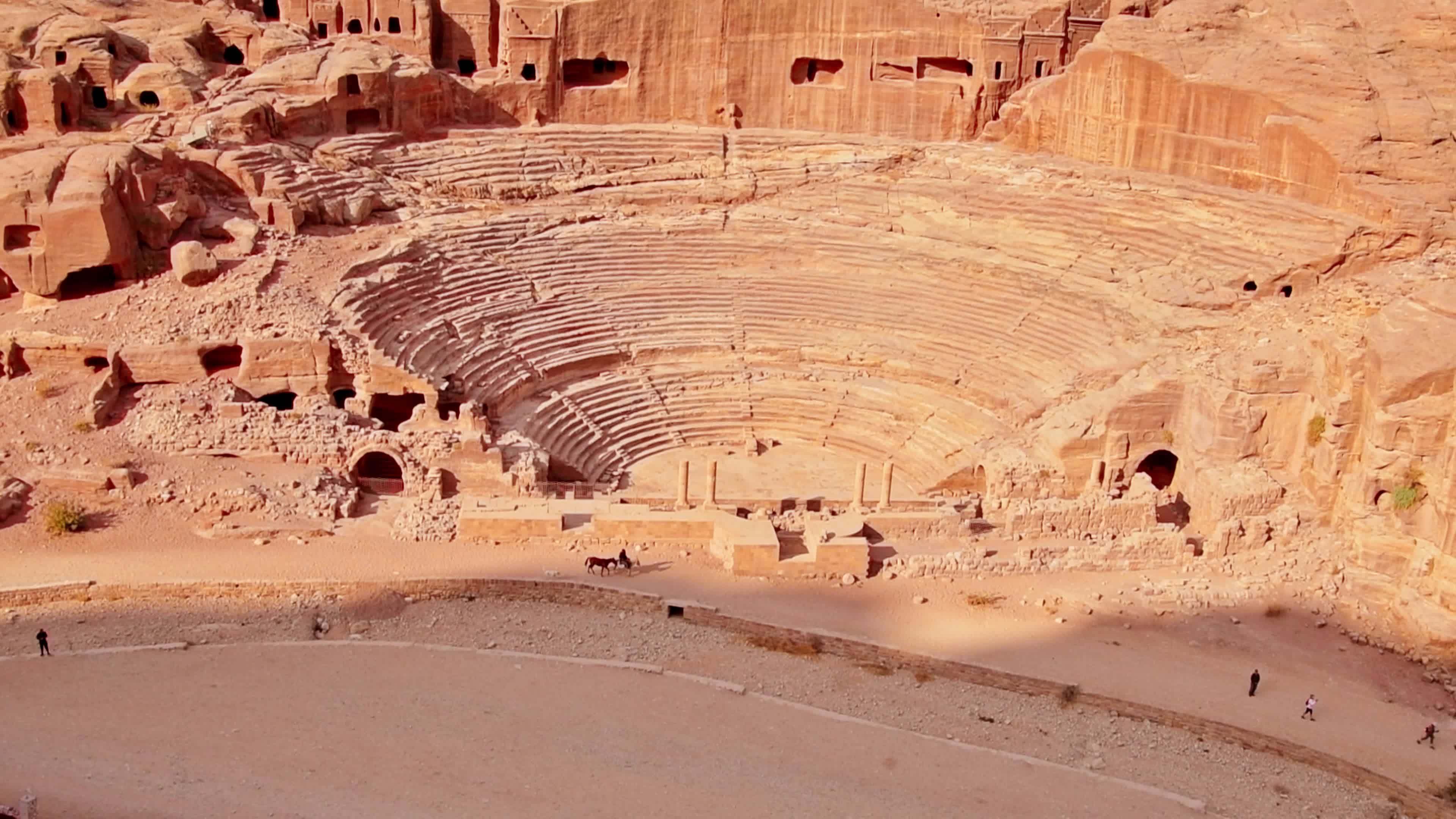 Tilt up aerial view ancient theater in Petra Rose City, Jordan. The ...