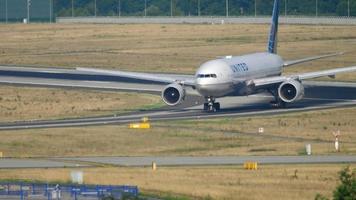 FRANKFURT AM MAIN, GERMANY JULY 19, 2017 - United Airlines Boeing 777 taxiing after landing on runway 25R. Fraport, Frankfurt, Germany video