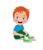 cute little boy tying his shoelaces vector