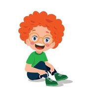 lindo niño atando sus cordones vector