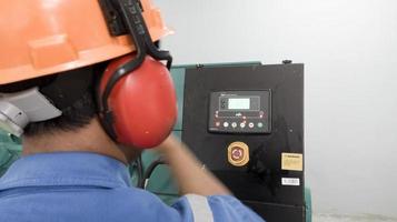 Pefessional engineering check and test perfomance the generator engine operarion. photo