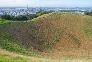 The summit crater of Mt.Eden with the scenics view of Auckland city in behind, North Island, New Zealand. photo