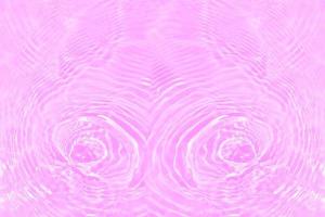 Defocus blurred transparent purple colored clear calm water surface texture with splashes and bubbles. Trendy abstract nature background. Water waves in sunlight with copy space. Pink water drop shine photo