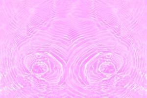 Defocus blurred transparent purple colored clear calm water surface texture with splashes and bubbles. Trendy abstract nature background. Water waves in sunlight with copy space. Pink water drop shine photo