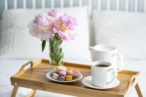 Tray with breakfast on bed. photo