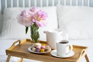 Tray with breakfast on bed. photo