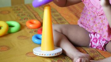 Child girl playing with toys on bed video