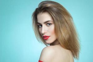 girl with red lips on blue background photo