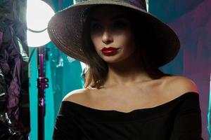 young woman with red lips and in hat photo