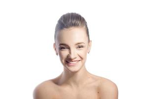 Attractive young girl smiling in studio photo