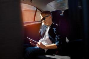 young stylish boy in sunglasses photo