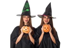 attractive young women with pumpkins in hands photo