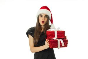 Attractive Woman in santa hat with red gift photo