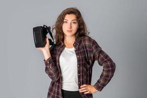 cutie young girl testing virtual reality glasses photo