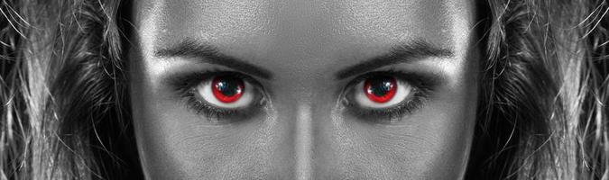 black and white photo of girl with red eyes