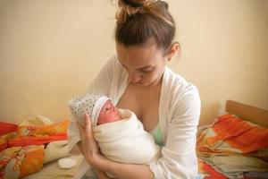 Mom and Her Little Newborn Girl photo