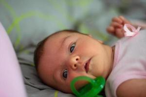 closeup portrait of a beautiful little baby girl photo