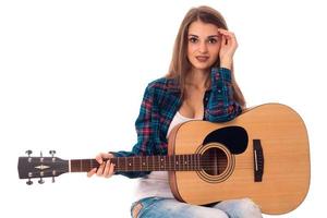 beautiful lady with guitar in hands photo