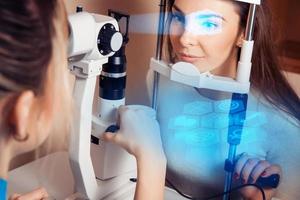 patient during an eye examination at the eye clinic photo