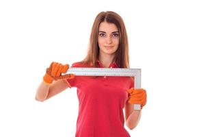 adorable brunette lady makes refurbish an apartment isolated on white background in studio photo