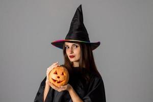 beauty young brunette girl in halloween style clothes photo