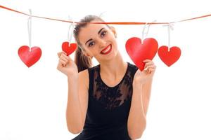 sweet stylish brunette lady celebrate saint valentines day with red heart isolated on white background photo