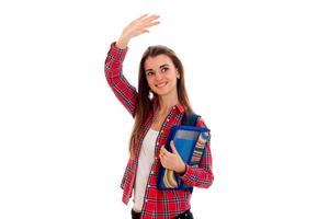 a cheerful young girl in Plaid Shirt raised hand up photo