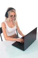 The girl in headphones with laptop photo