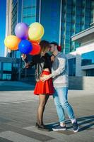 young couple outdoors hugging photo