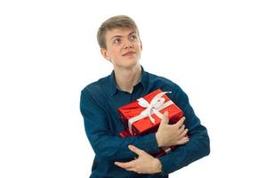 young man hugging his gifts photo