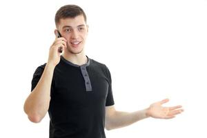 handsome young man talking phone and smiling photo