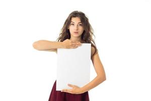 girl in red dress with white placard photo