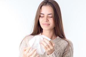 girl holds before  handkerchief in her hands isolated on white background photo