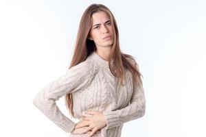 girl feels pain in his side and kept him isolated on white background photo