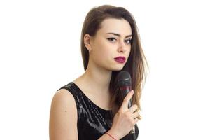 Beautiful lady in black dress with microphone photo